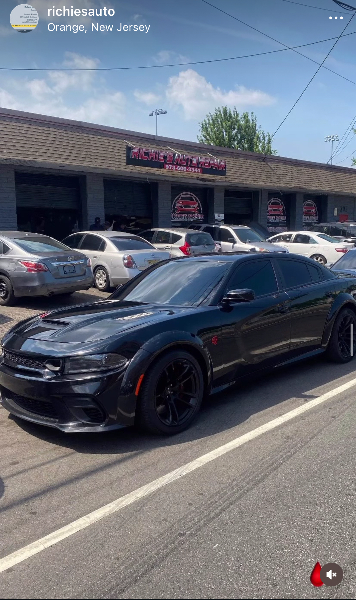 Black Dodge Charger outside Richie's Auto Repair